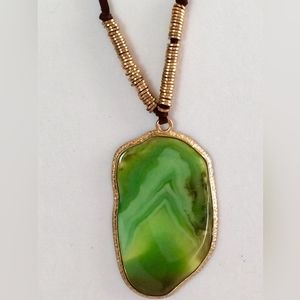 Green agate slice pendant on gold-tone black necklace